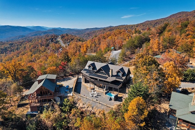 birds eye view of property with a mountain view