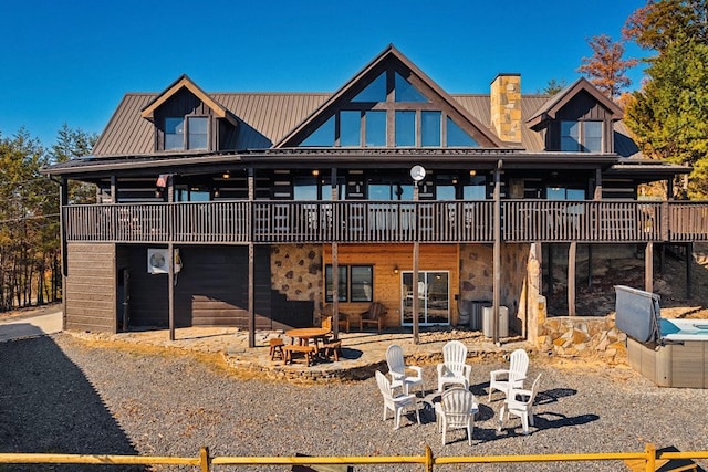 back of house with a patio area and a deck