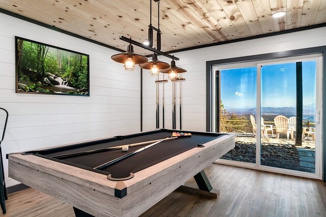 playroom featuring hardwood / wood-style flooring, wood walls, wood ceiling, and pool table