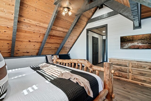 bedroom featuring vaulted ceiling with beams, wooden walls, hardwood / wood-style flooring, and wooden ceiling