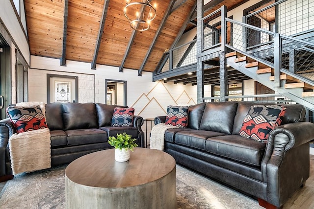 living room featuring beam ceiling, high vaulted ceiling, wooden ceiling, and a notable chandelier