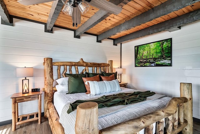 bedroom with beam ceiling, ceiling fan, wooden ceiling, and hardwood / wood-style flooring