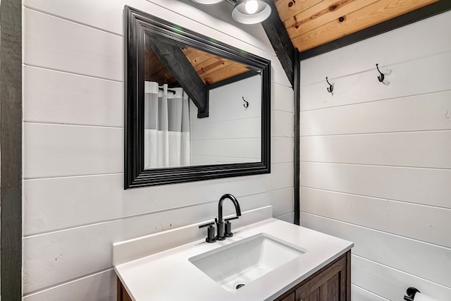 bathroom with vanity, wood ceiling, and lofted ceiling