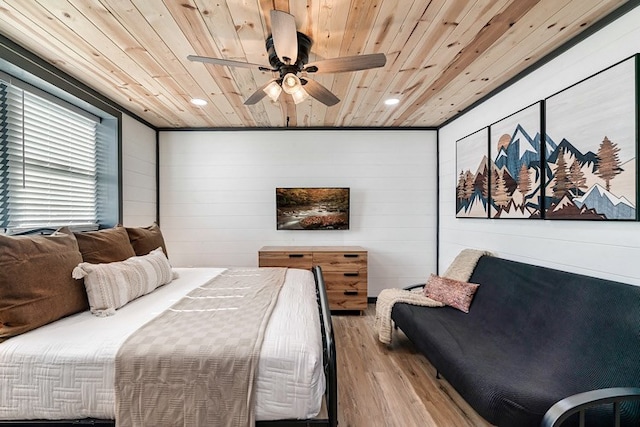 bedroom featuring light wood-type flooring, ceiling fan, wood walls, and wood ceiling