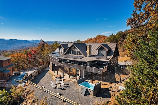 back of property with a mountain view