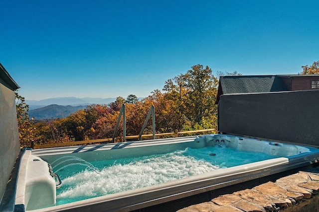 view of swimming pool featuring a mountain view