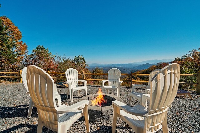 view of patio featuring a mountain view and a fire pit