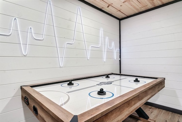 recreation room featuring wood-type flooring, wood ceiling, and wood walls