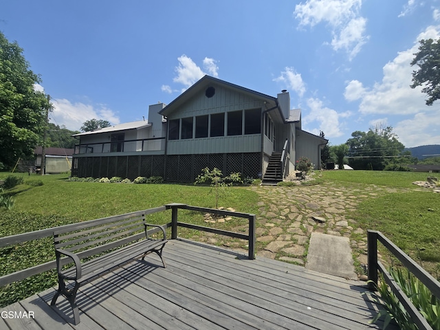 2257 Shinbone Rd, Sevierville, TN 37876 - deck featuring stairway, a sunroom, and a lawn