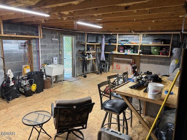2257 Shinbone Rd, Sevierville, TN 37876 - basement with water heater and a sink