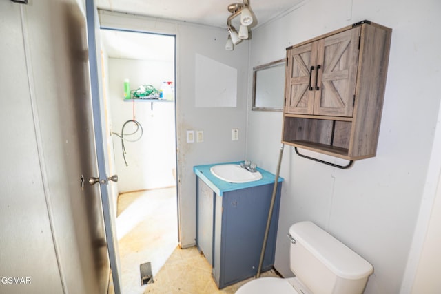 bathroom with toilet and vanity