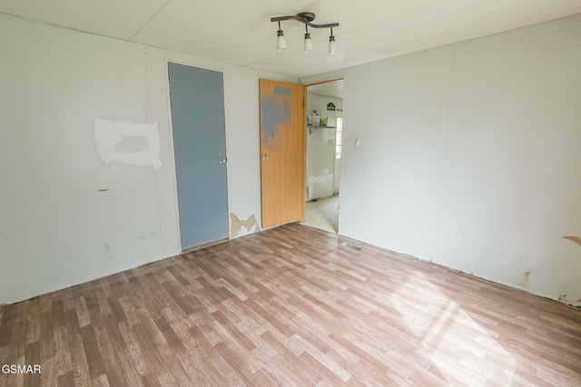 empty room featuring wood finished floors