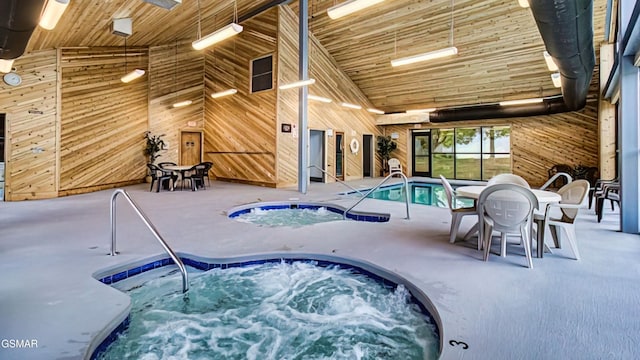 view of swimming pool featuring an indoor in ground hot tub