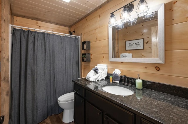 full bathroom featuring toilet, curtained shower, wooden walls, wooden ceiling, and vanity