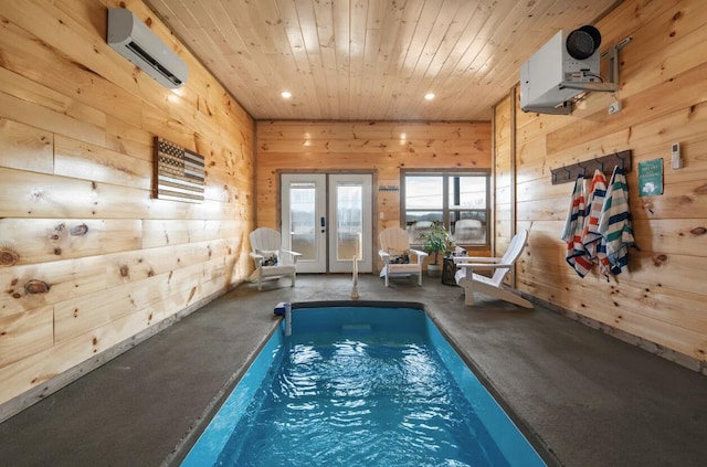 pool featuring french doors and a wall unit AC