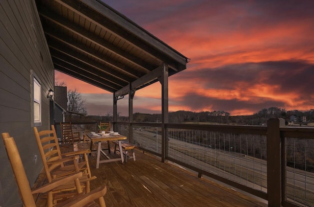 deck with outdoor dining space