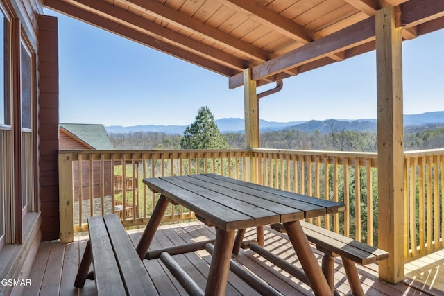 wooden deck with a mountain view