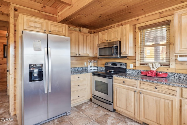 kitchen with dark stone countertops, stainless steel appliances, wooden ceiling, and light brown cabinets