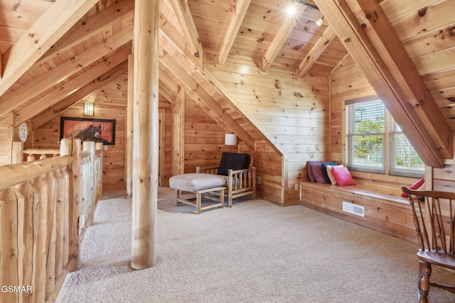 bonus room with wood ceiling, visible vents, and wooden walls