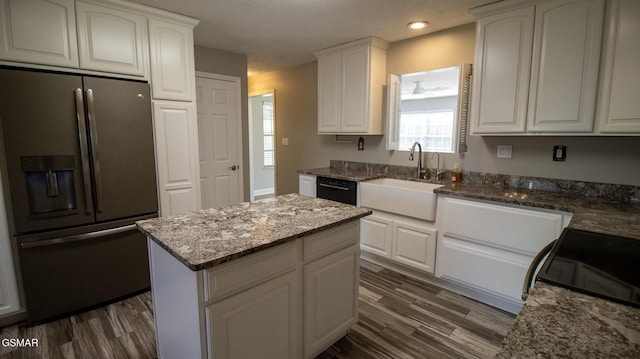 kitchen with white cabinetry, stainless steel refrigerator with ice dispenser, and dark wood-style floors
