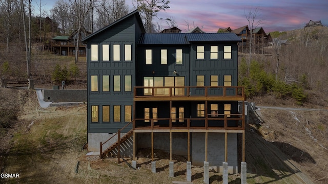 3540 Mountain Tyme Way, Sevierville, TN 37862 - rear view of property featuring board and batten siding, a deck, metal roof, stairs, and a balcony