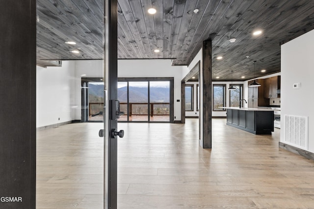 3540 Mountain Tyme Way, Sevierville, TN 37862 - exercise area with light wood finished floors, a sink, recessed lighting, french doors, and baseboards