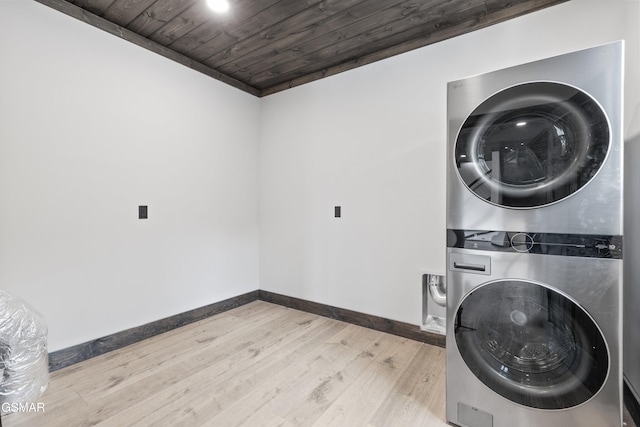 3540 Mountain Tyme Way, Sevierville, TN 37862 - washroom with stacked washing machine and dryer, wood ceiling, baseboards, and light wood-style floors