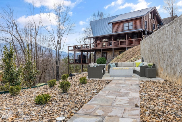 3540 Mountain Tyme Way, Sevierville, TN 37862 - rear view of property with outdoor lounge area, metal roof, a patio, a wooden deck, and log exterior