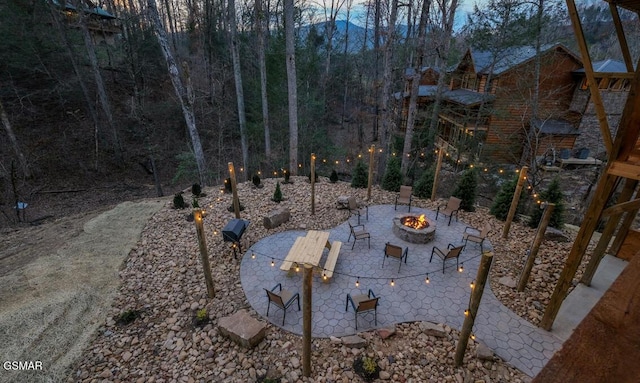 view of patio featuring an outdoor fire pit