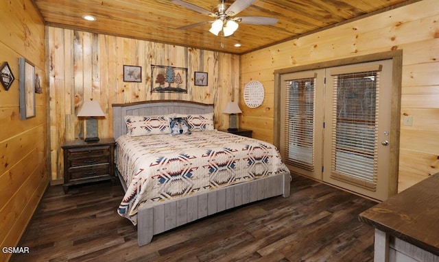 bedroom featuring wooden walls, wooden ceiling, ceiling fan, access to outside, and dark hardwood / wood-style flooring