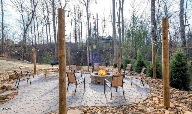 view of patio / terrace featuring a fire pit