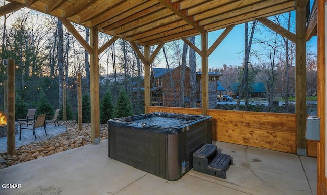 view of patio / terrace with a hot tub