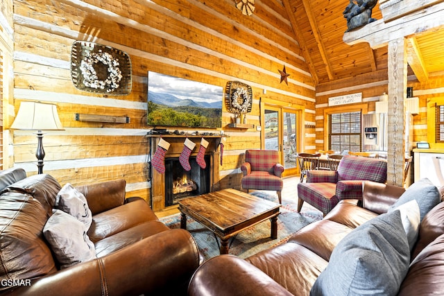 living area with a warm lit fireplace, wood finished floors, french doors, wooden walls, and wooden ceiling