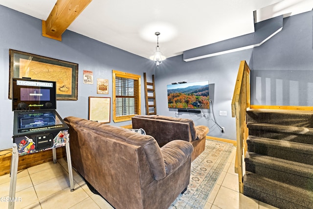 tiled living area featuring stairway, beamed ceiling, and baseboards