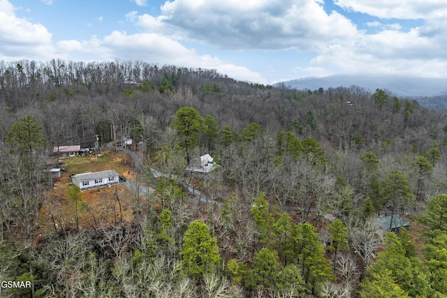 bird's eye view featuring a wooded view