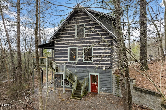 view of front of home with stairs