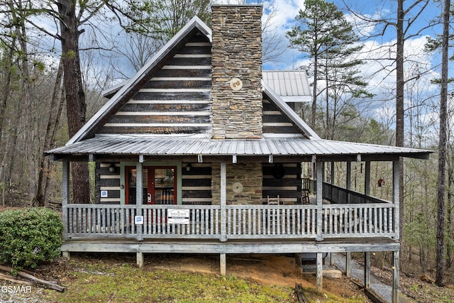 view of front of house with covered porch and metal roof