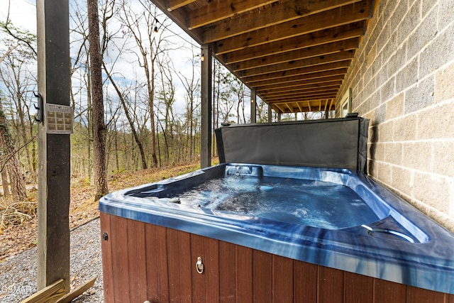 wooden deck with a hot tub