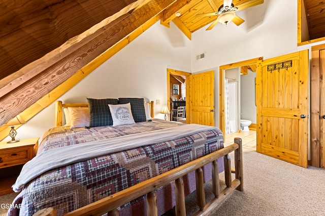 tiled bedroom featuring visible vents, carpet floors, high vaulted ceiling, beamed ceiling, and connected bathroom