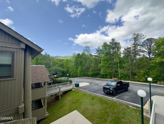 3710 Weber Rd Unit E306, Gatlinburg, TN 37738 - uncovered parking lot featuring a view of trees