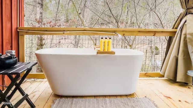 122 Quail Roost Dr, Cosby, TN 37722 - bathroom view of a freestanding tub and wood finished floors