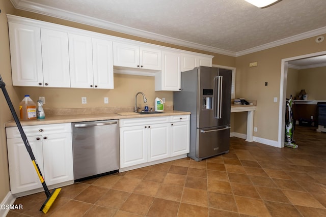 kitchen with sink, crown molding, stainless steel appliances, a textured ceiling, and white cabinets