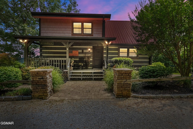 4091 Camp Hollow Rd, Sevierville, TN 37876 - view of front facade with a metal roof and a porch