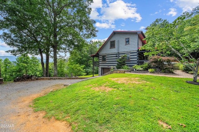 4091 Camp Hollow Rd, Sevierville, TN 37876 - view of side of property featuring gravel driveway, a garage, and a yard