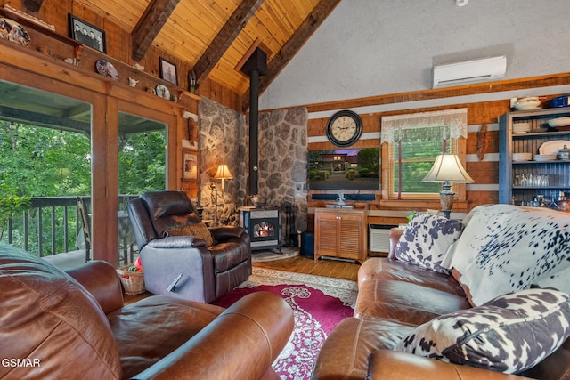 4091 Camp Hollow Rd, Sevierville, TN 37876 - living room with a wall mounted air conditioner, a wood stove, hardwood / wood-style flooring, a wood ceiling with exposed beams, and high vaulted ceiling