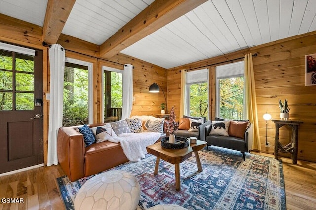 sunroom featuring beamed ceiling