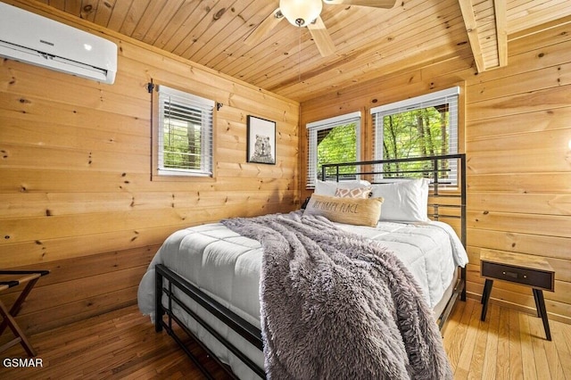 bedroom featuring wood walls, wooden ceiling, hardwood / wood-style flooring, ceiling fan, and a wall unit AC