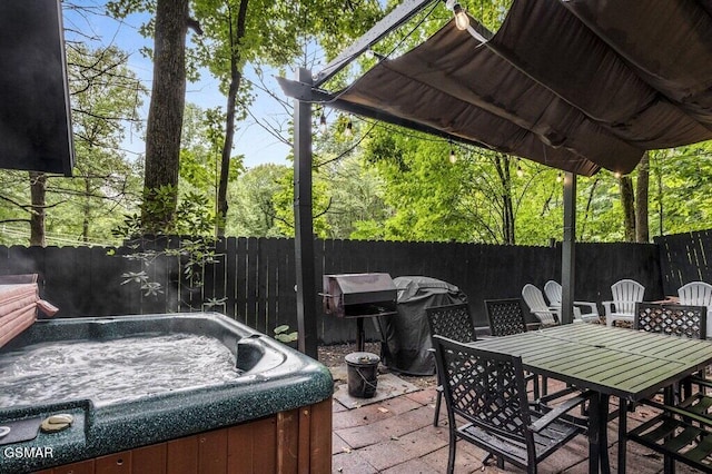 view of patio / terrace featuring a hot tub