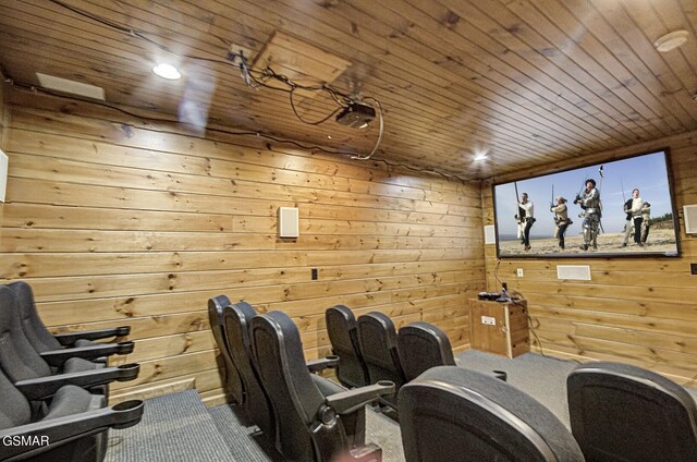 cinema room with wood walls and wood ceiling