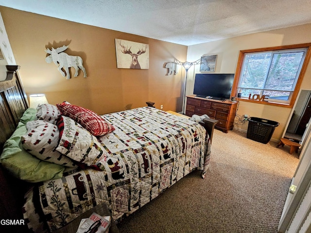 bedroom with carpet floors and a textured ceiling